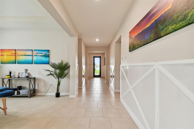 hallway featuring tile patterned flooring