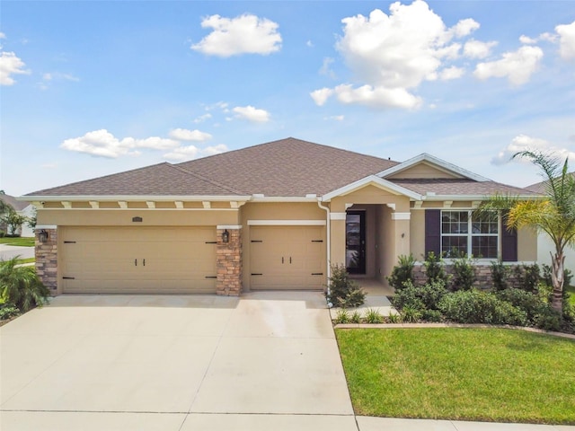 view of front of house with a garage and a front yard