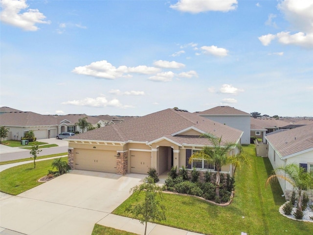 view of front of house with a garage and a front yard