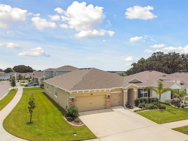 view of front facade with a garage and a front lawn