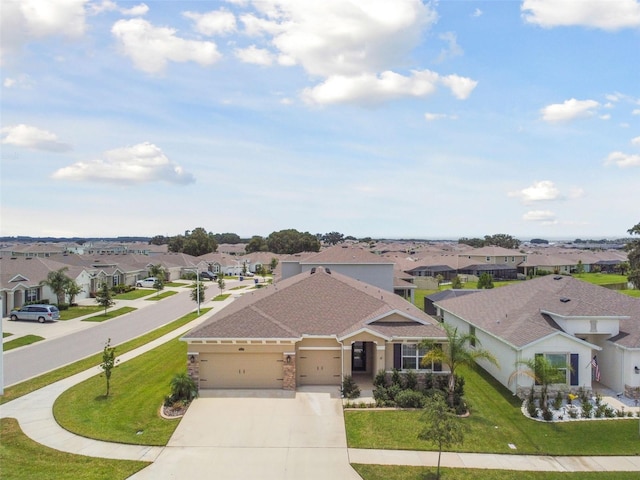 view of front of house with a garage and a front yard