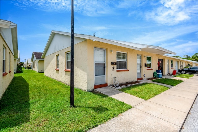 view of front of property with a front lawn