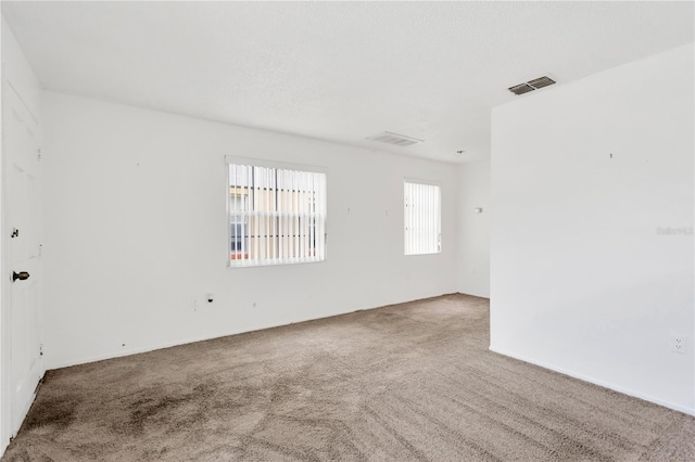 spare room featuring carpet flooring