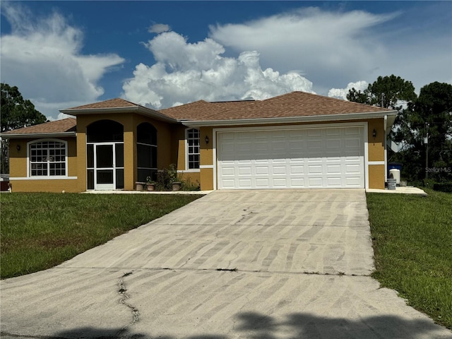 view of front of property featuring a garage and a front yard