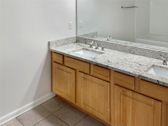 bathroom with tile patterned flooring and double vanity