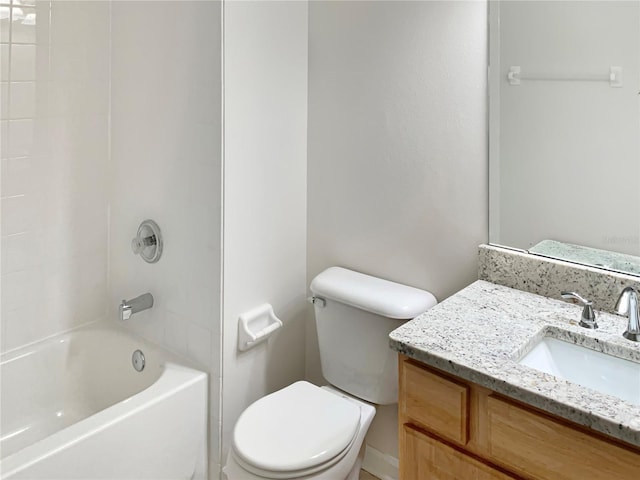 full bathroom with vanity, tiled shower / bath, and toilet