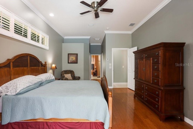 bedroom featuring ceiling fan, dark wood-type flooring, and crown molding