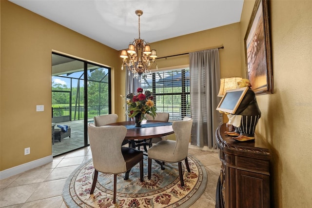 tiled dining space with a chandelier and a wealth of natural light