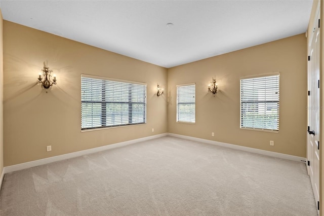 spare room with light colored carpet