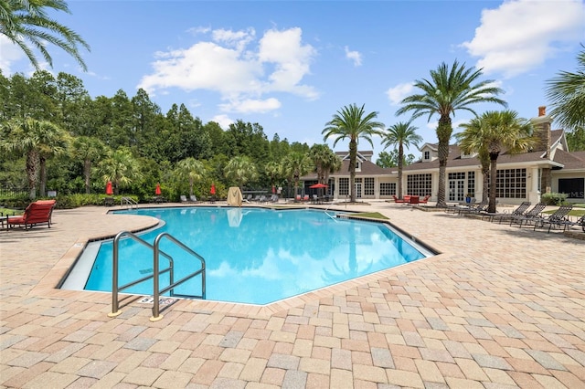 view of swimming pool with a patio area