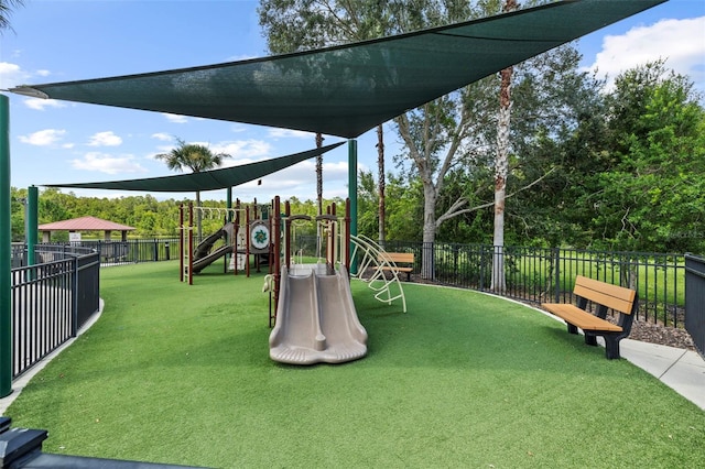 view of playground featuring a lawn