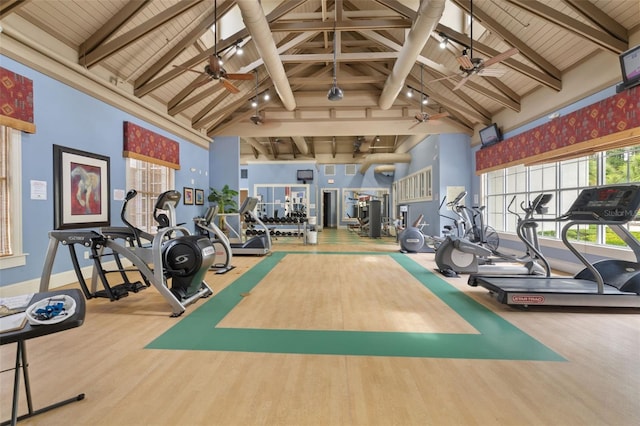 gym with high vaulted ceiling, wooden ceiling, and wood-type flooring