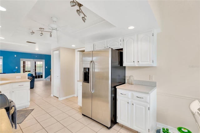 kitchen with ceiling fan, white cabinets, stainless steel fridge with ice dispenser, french doors, and light tile patterned floors