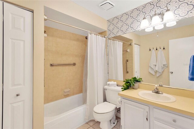 full bathroom featuring tile patterned flooring, shower / bath combo, toilet, and vanity