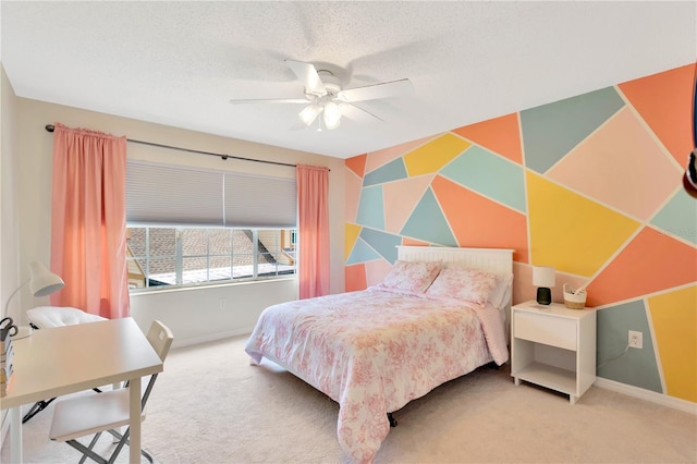 bedroom with carpet floors, a textured ceiling, and ceiling fan