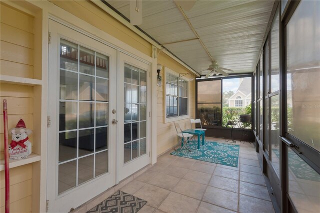 sunroom with french doors and ceiling fan