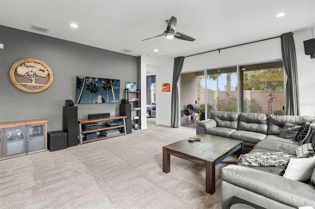 living room with light colored carpet and ceiling fan