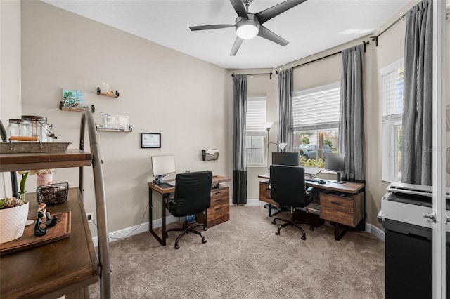 office space featuring ceiling fan and light colored carpet