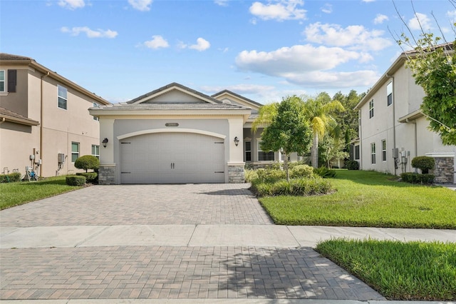 view of front of home featuring a garage and a front lawn