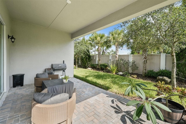 view of patio featuring a grill