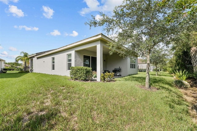 view of property exterior with a yard