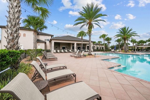 view of swimming pool with a patio area