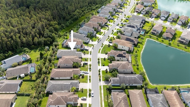 birds eye view of property with a water view