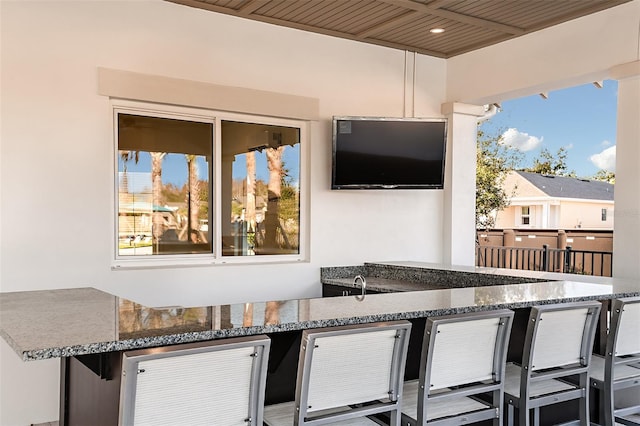 view of patio / terrace featuring an outdoor bar