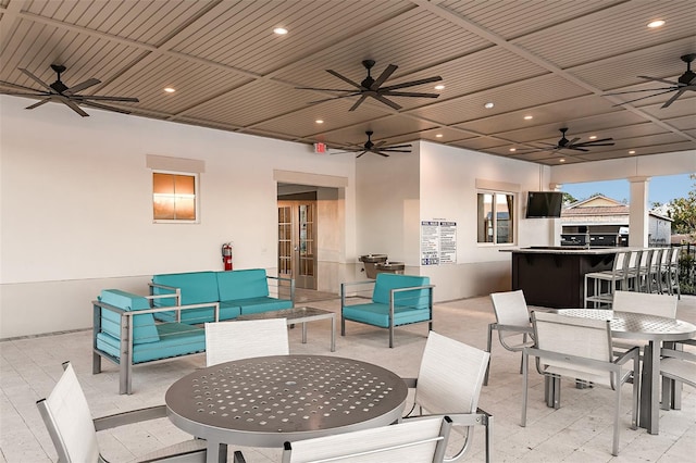 view of patio featuring outdoor lounge area, an outdoor bar, and ceiling fan