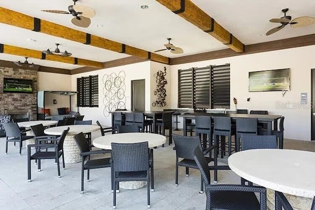 7472 Oakmoss Loop, Davenport, FL 33837 - view of patio featuring ceiling fan, outdoor dining space, and exterior bar