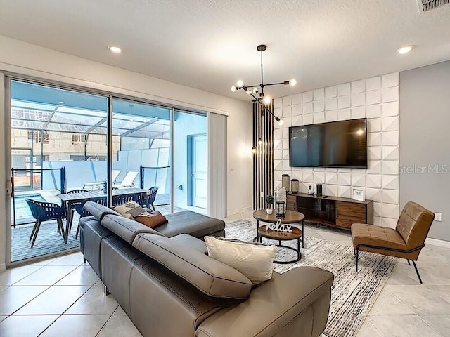 7472 Oakmoss Loop, Davenport, FL 33837 - living area featuring light tile patterned floors, a chandelier, baseboards, and recessed lighting