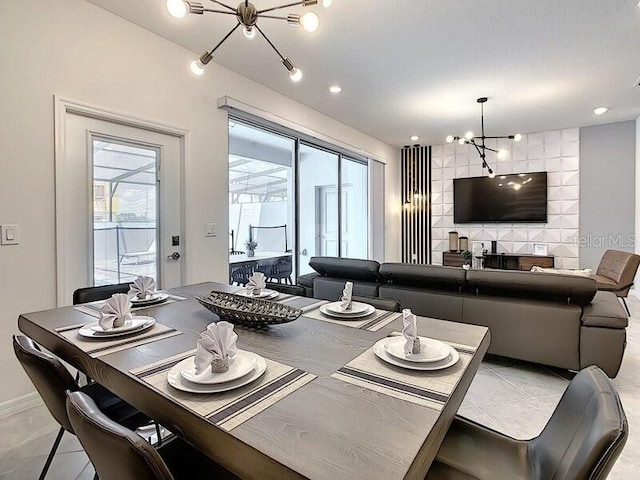 dining area featuring an inviting chandelier and light tile patterned floors