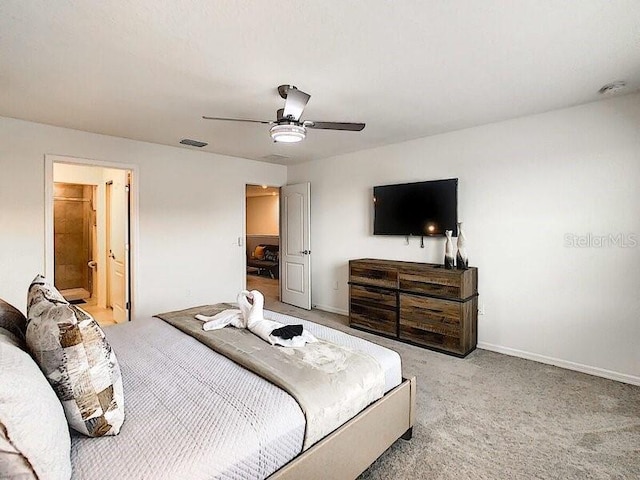 7472 Oakmoss Loop, Davenport, FL 33837 - bedroom with light colored carpet, baseboards, and ceiling fan