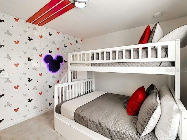 7472 Oakmoss Loop, Davenport, FL 33837 - bedroom with wallpapered walls, light colored carpet, and baseboards