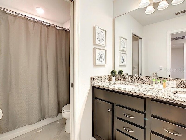 7472 Oakmoss Loop, Davenport, FL 33837 - full bathroom with double vanity, toilet, and a shower with shower curtain