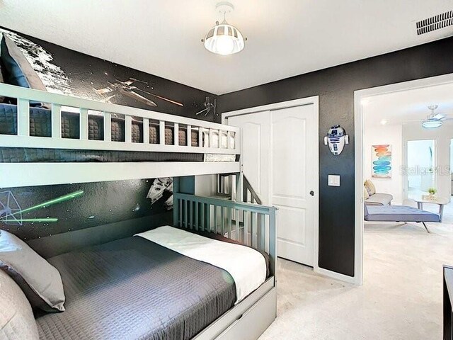 7472 Oakmoss Loop, Davenport, FL 33837 - bedroom with carpet and a closet