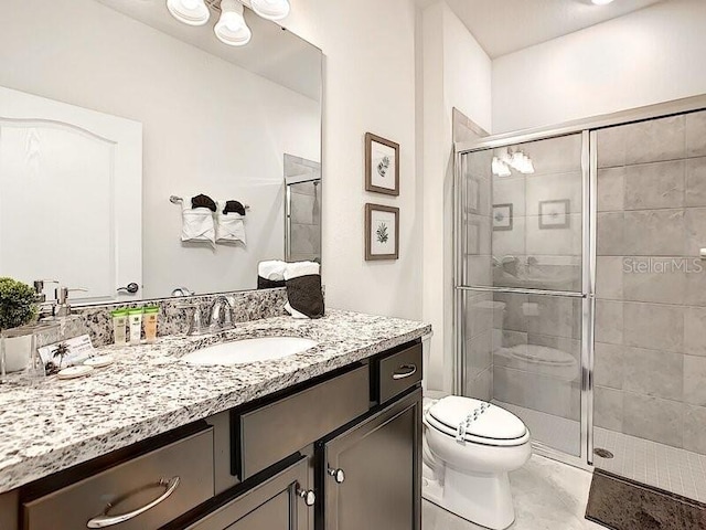 7472 Oakmoss Loop, Davenport, FL 33837 - full bathroom featuring toilet, vanity, and a shower stall