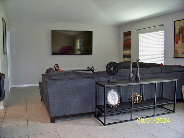 living room with light tile patterned floors