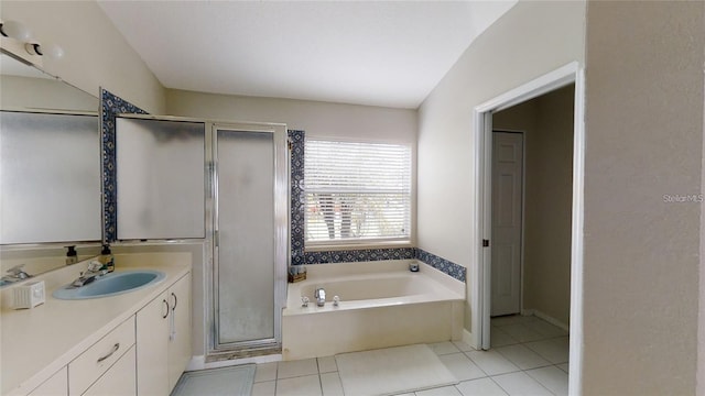 bathroom with shower with separate bathtub, lofted ceiling, vanity, and tile patterned floors