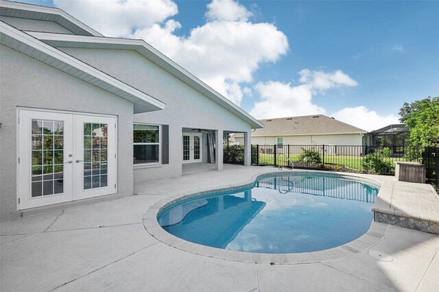 view of pool with a patio and french doors