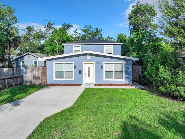 view of property featuring a front yard