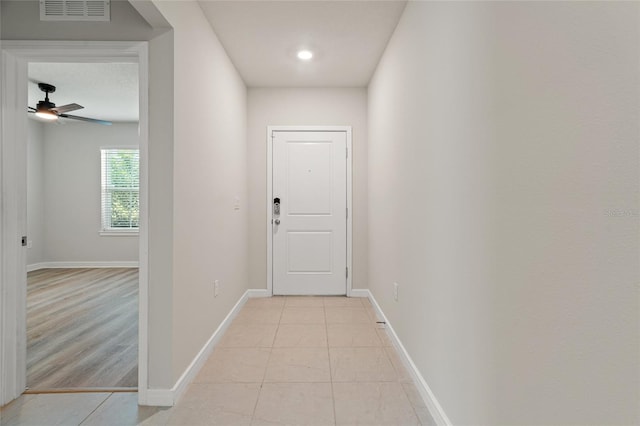 hall with light tile patterned flooring