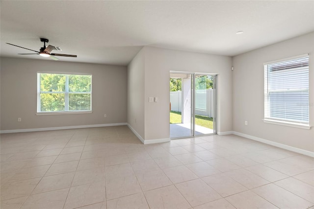 empty room with light tile patterned flooring and ceiling fan