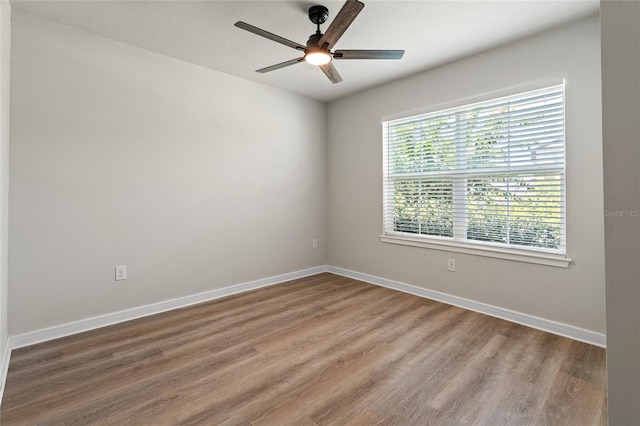 unfurnished room featuring ceiling fan and wood-type flooring