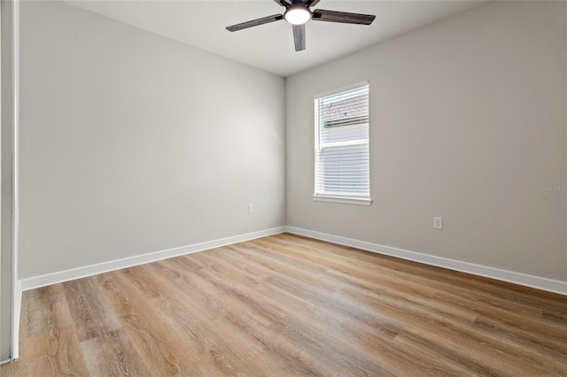 unfurnished room with ceiling fan and light wood-type flooring