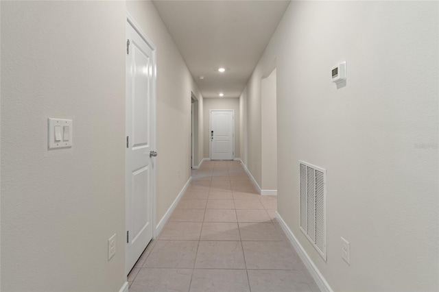 hallway featuring light tile patterned floors