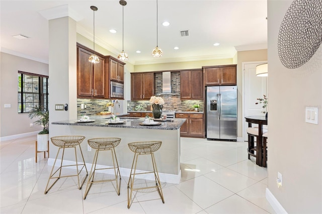 kitchen featuring sink, dark stone countertops, stainless steel appliances, kitchen peninsula, and wall chimney exhaust hood