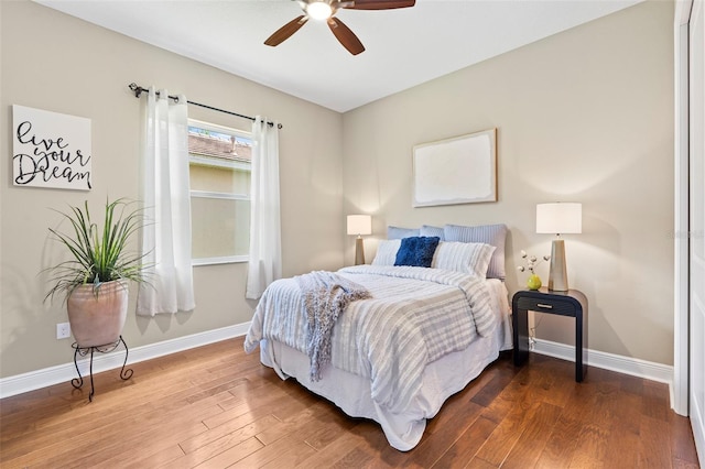 bedroom featuring hardwood / wood-style floors and ceiling fan