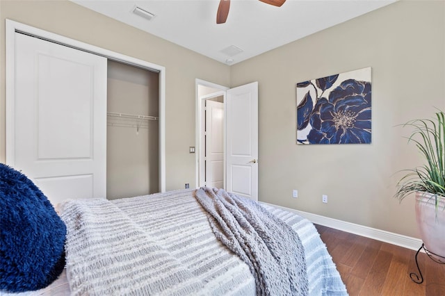 bedroom featuring ceiling fan, hardwood / wood-style floors, and a closet