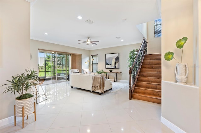 tiled living room featuring ornamental molding and ceiling fan